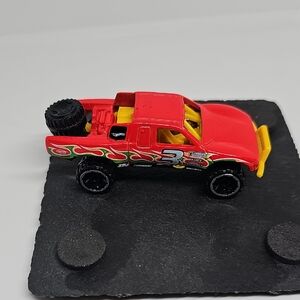 Red Toy Truck with Yellow Accents
